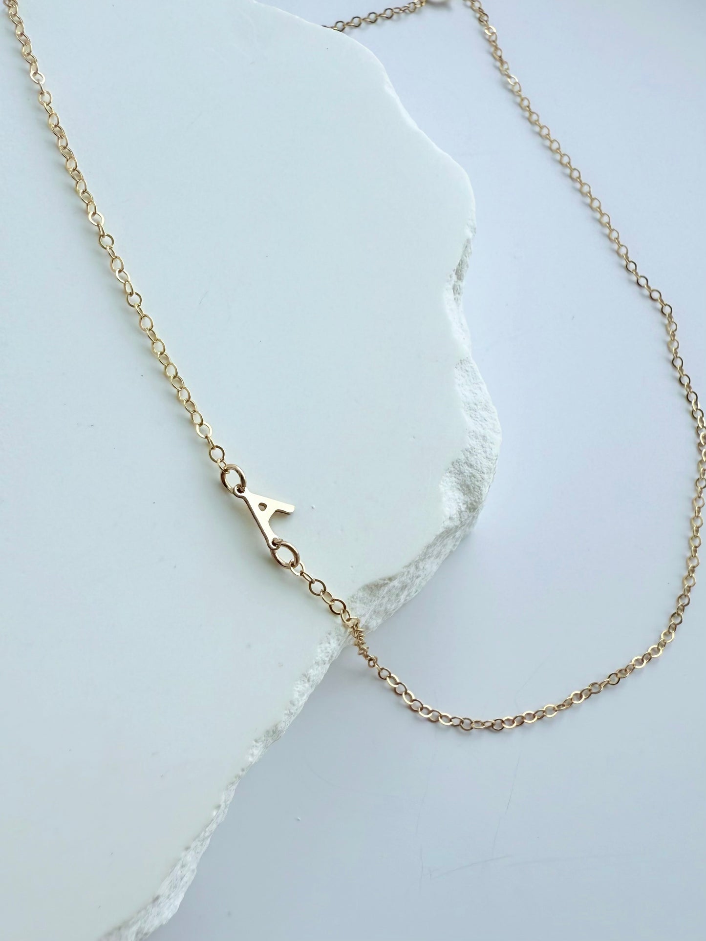 Sideways Letter Stationary Necklace
