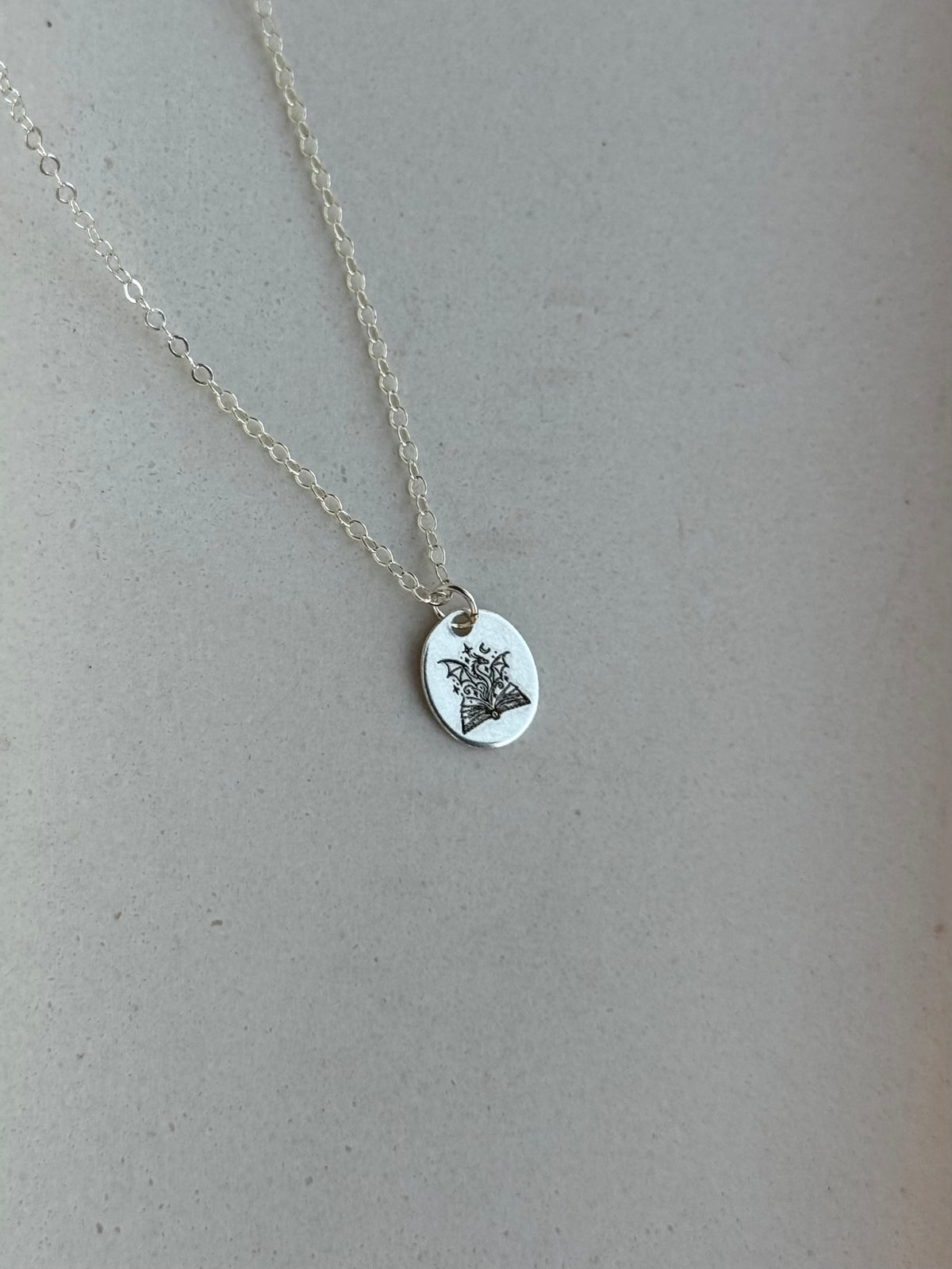 Dragon Book Medium Oval Necklace