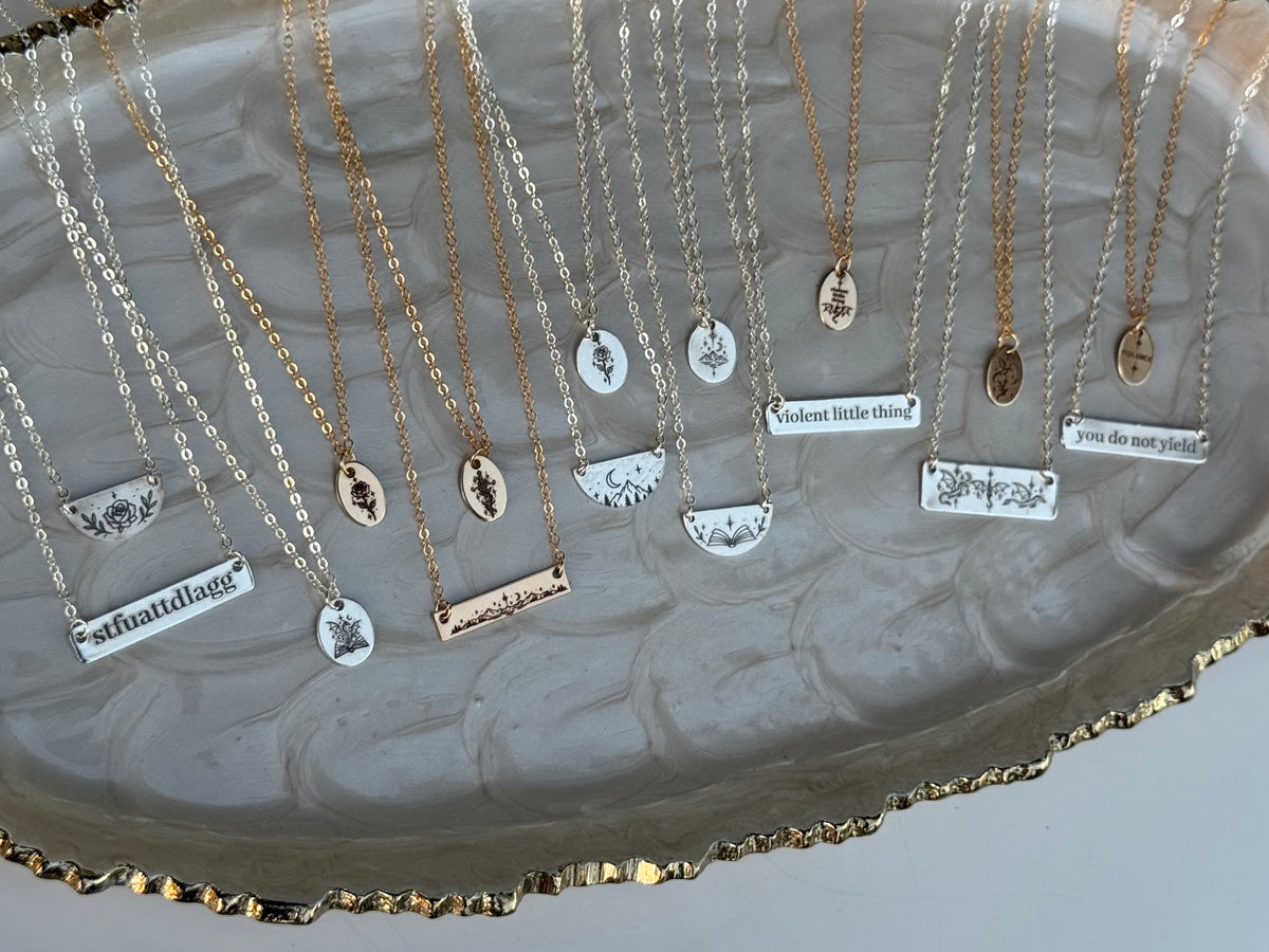 Dragon Book Medium Oval Necklace